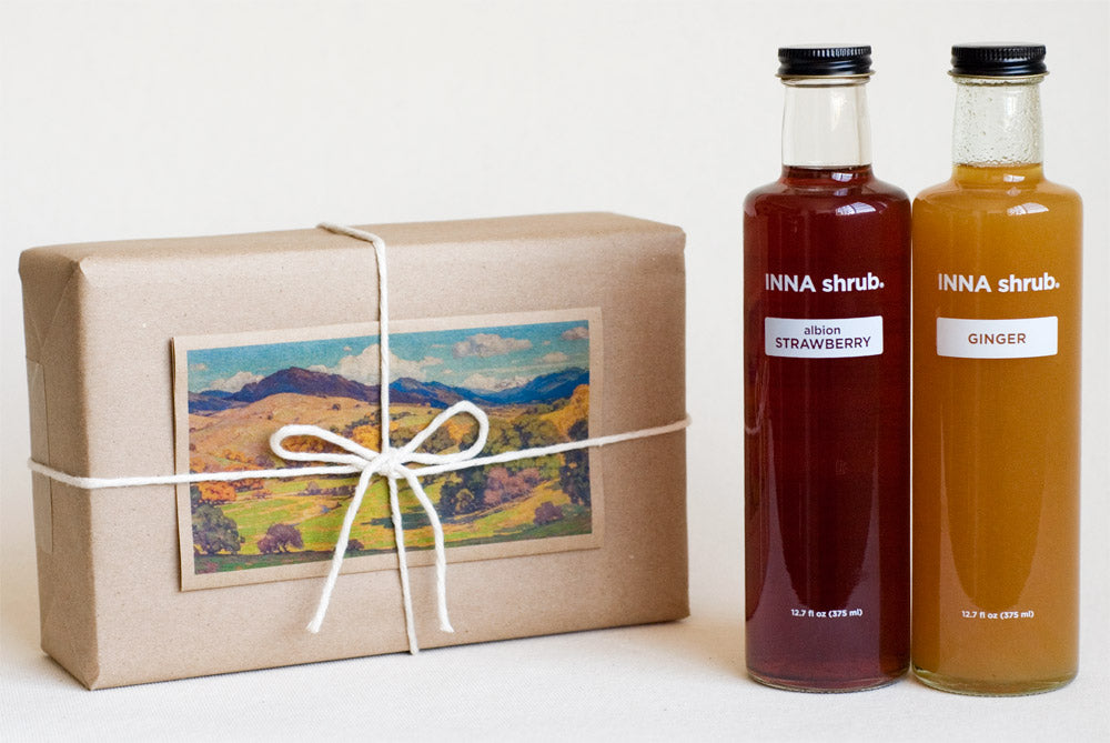 GIFT: 2 bottles of shrub, wrapped in KRAFT paper with an ART card