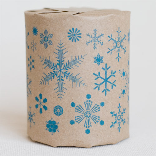 "Snow Flakes" gift wrap features illustrations of snowflakes (blue print on kraft paper)